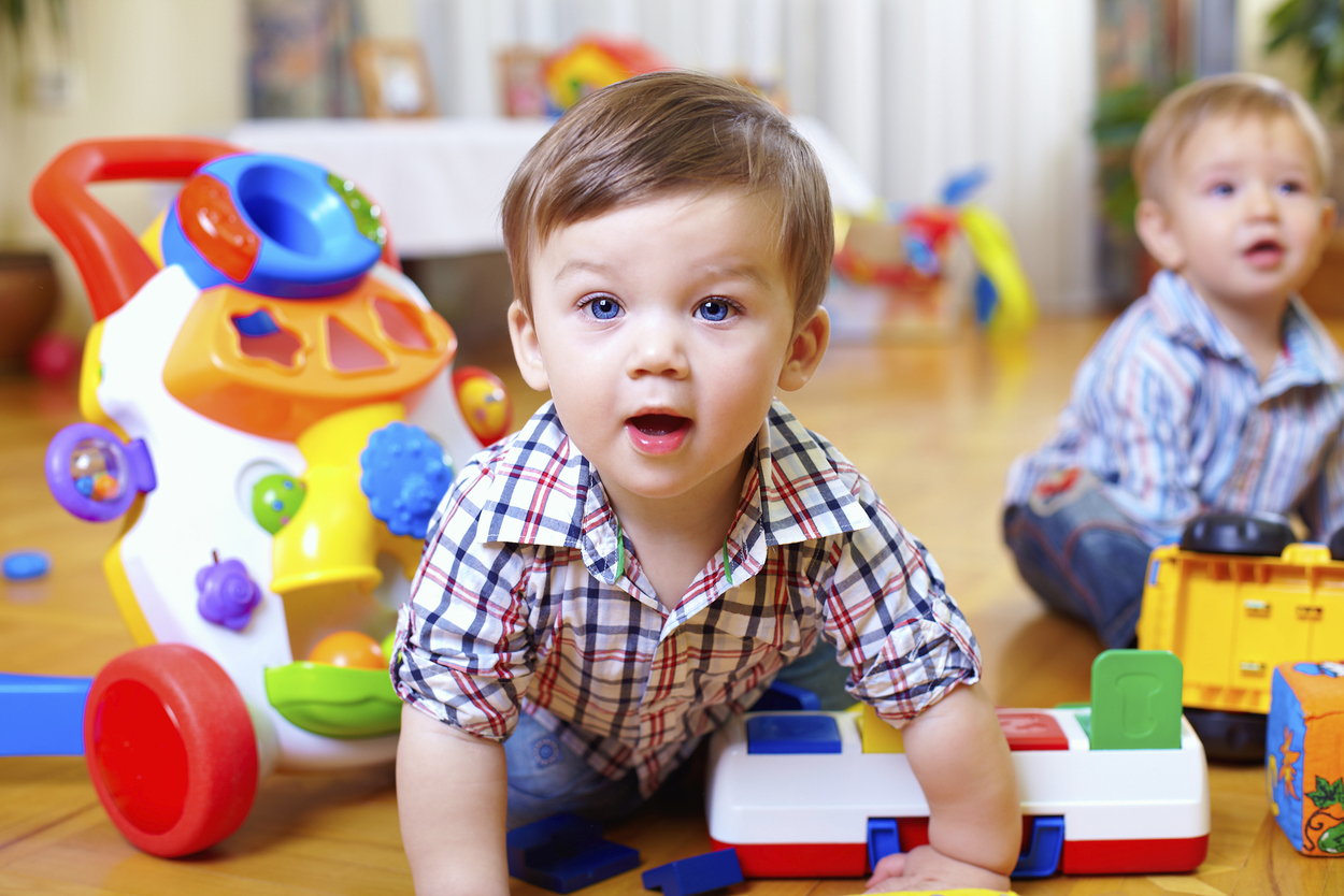 curious baby boy studying nursery room